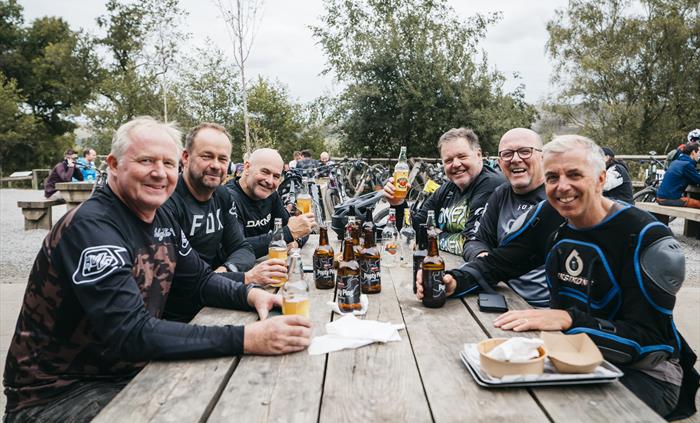 Friends enjoying a beer after riding